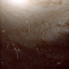 Asteroīdu pēdas galaktikas NGC 4548 attēlā; autortiesības: R. Evans and K. Stapelfeldt (Jet Propulsi