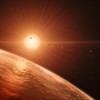 Skats uz TRAPPIST-1 sistēmu mākslinieka interpretācijā