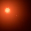Skats uz TRAPPIST-1 sistēmu mākslinieka interpretācijā